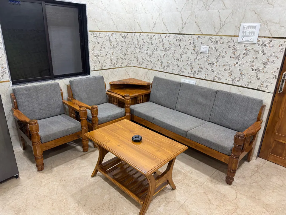 Grey sofa set and a wooden coffee table in the sitting area